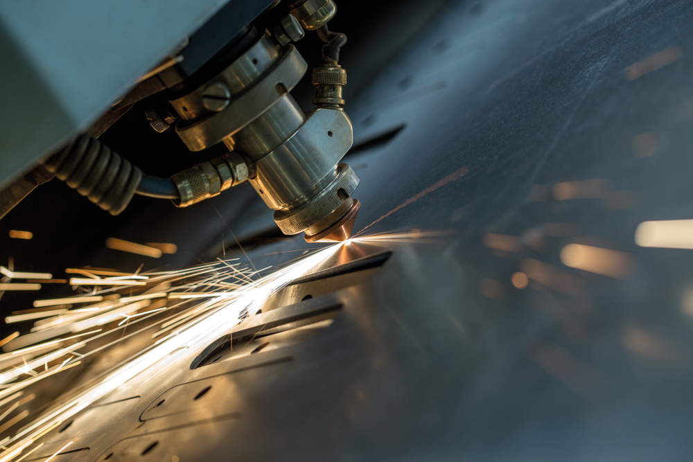 industrial laser cutting machine cutting a metal sheet, close-up